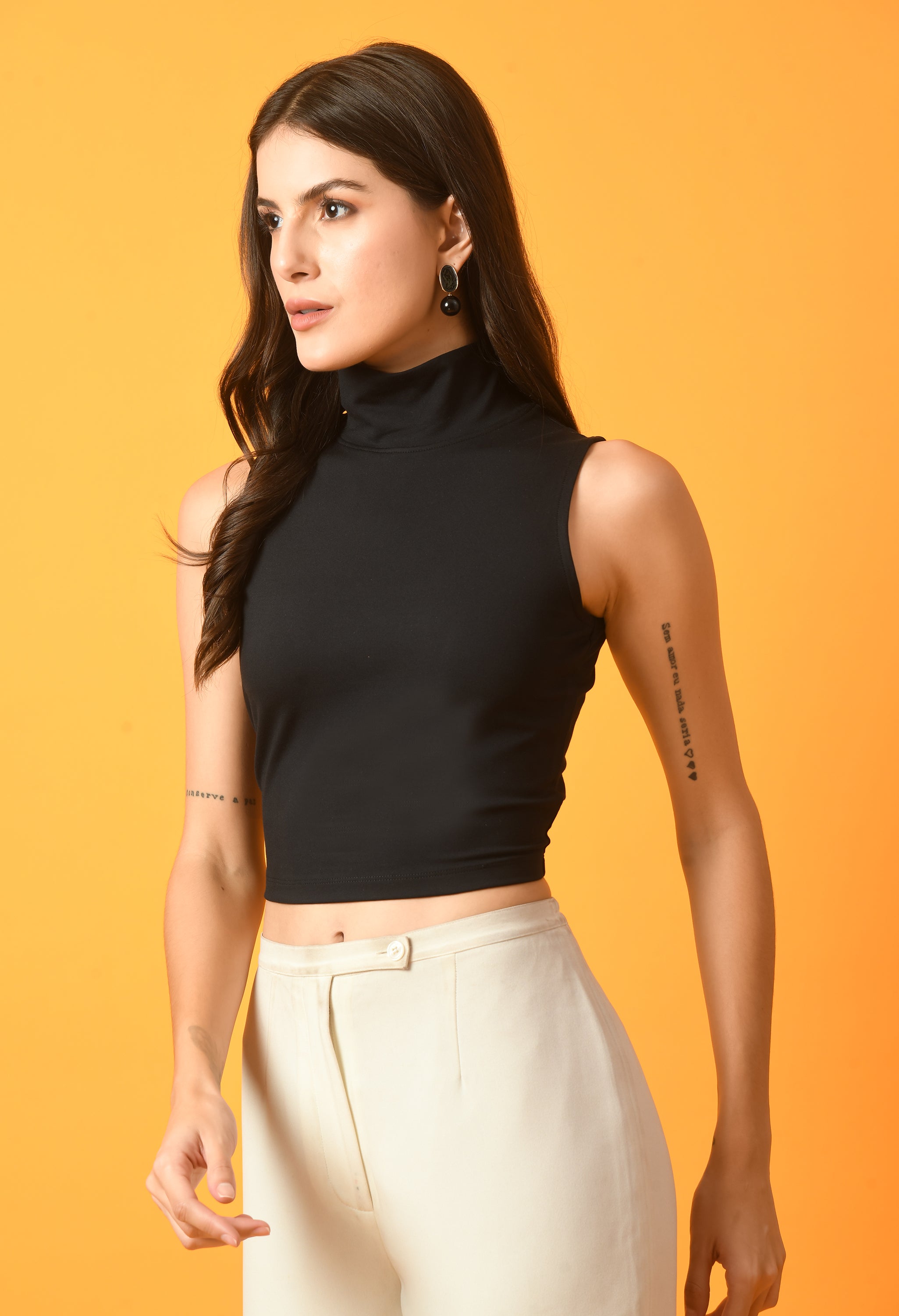 Women Solid White Ribbed Sleeveless Crop Top with a Turtle Neck